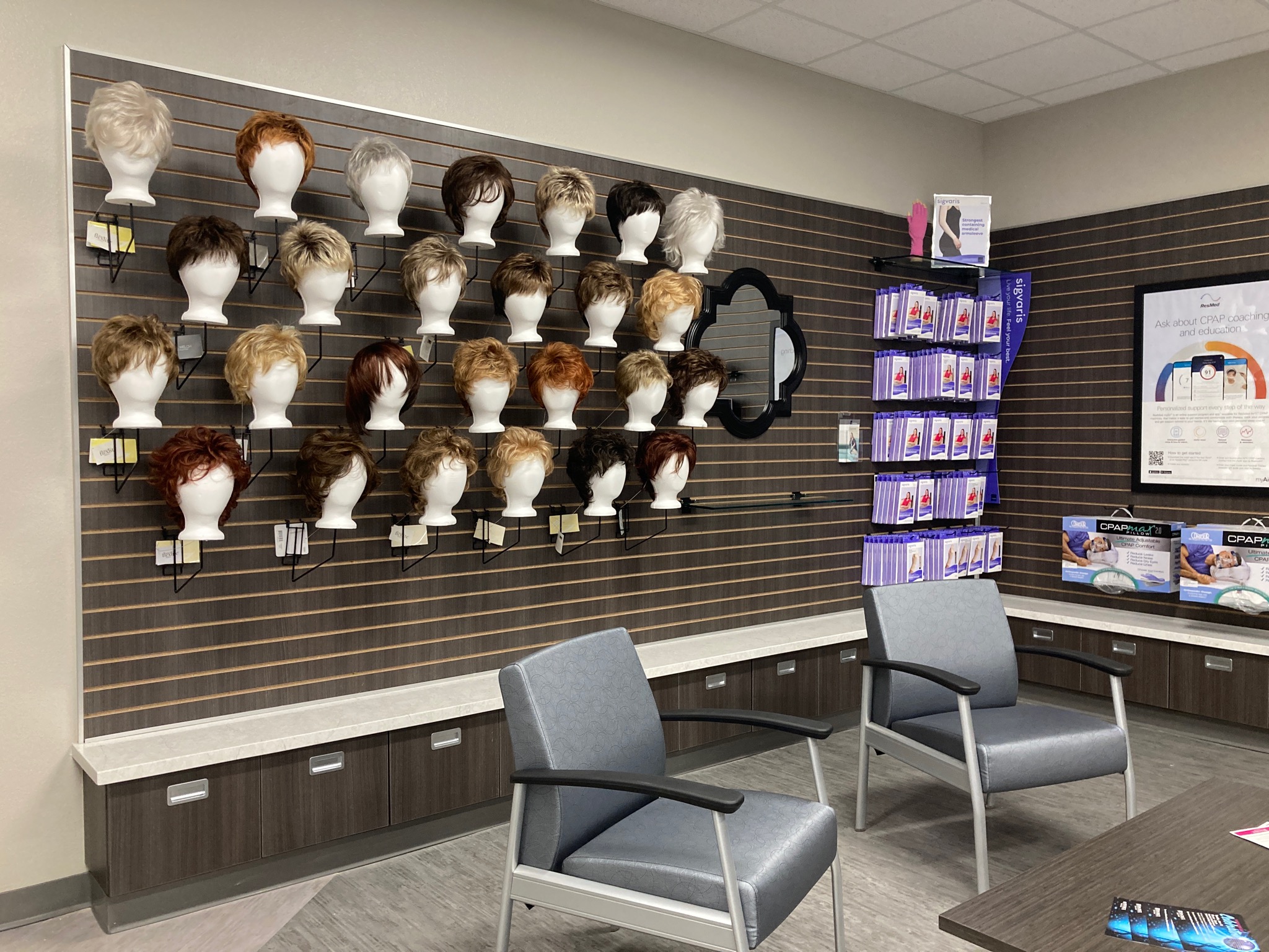 Photo of wigs displayed on wall at Hendrick Medical Supply