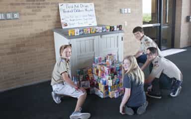 Scouts setting up band-aid donation